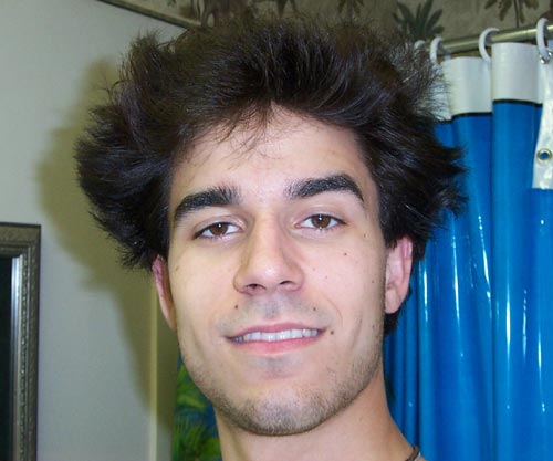 Steve styles his hair.